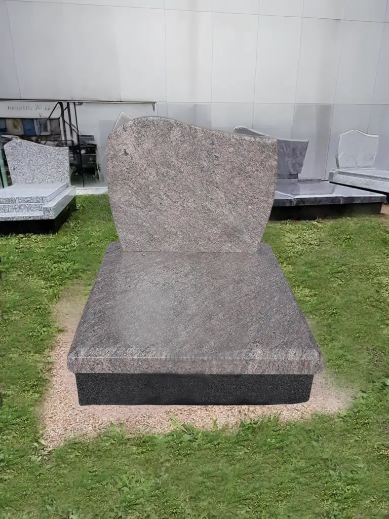 Monument cinéraire contemporain en granit rose avec stèle galbée.